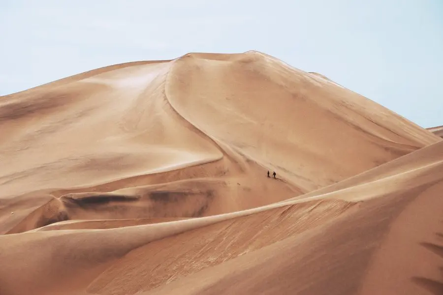 Climbing a dune in the Namib Desert, Namibia | Go2Africa